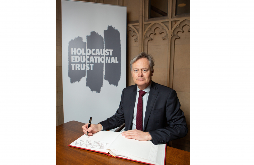 Matthew signing the Holocaust Educational Trust's Book of Commitment in Parliament. 