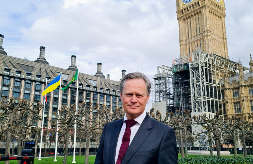 Matthew Offord MP with the Ukrainian flag flying outside Parliament